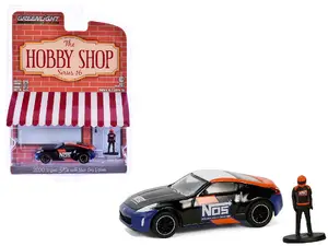 Greenlight 97160F - 2020 Nissan 370z "NOS Nitrous Oxide Systems" Black with Graphics and Race Car Driver "The Hobby Shop" Series 16 1/64 Diecast Model Car by Greenlight